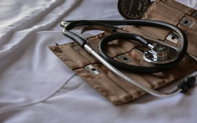 black stethoscope with brown leather case